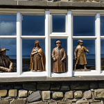 **Prompt:** "Bronze sculptures of historical figures in Douglas, Isle of Man. Depicting scenes of Manx history, creating a window to the past. Public art enhancing cultural identity."